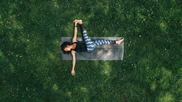 woman doing yoga in the park